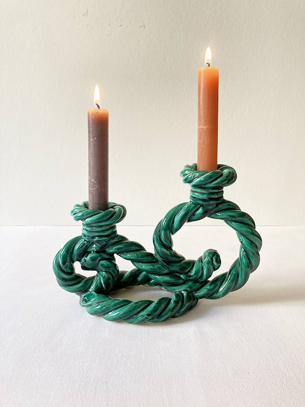 Two-armed candlestick in green glazed ceramic, braided effect