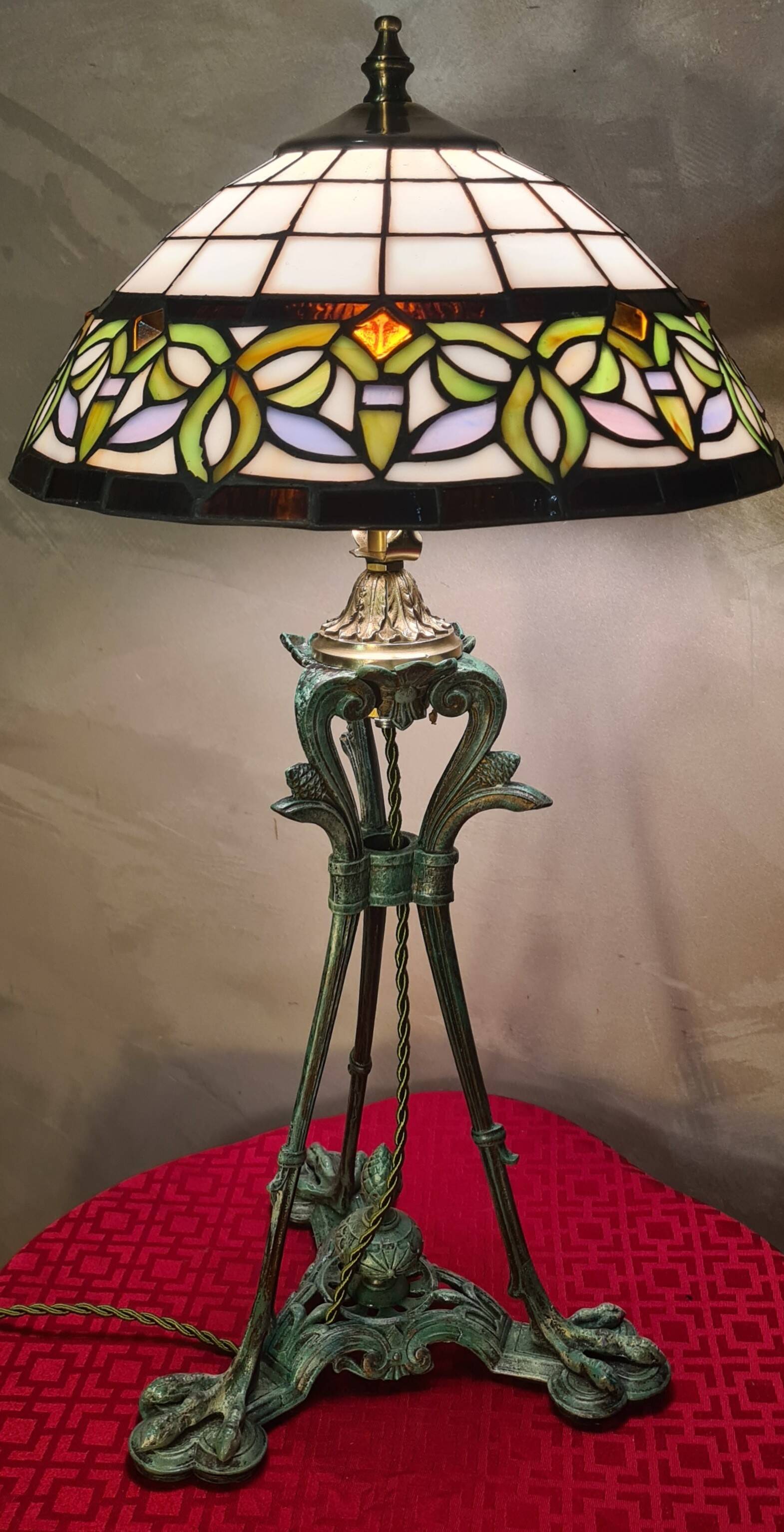 Antique patinated bronze regulator lamp with Tiffany glass shade in very good condition