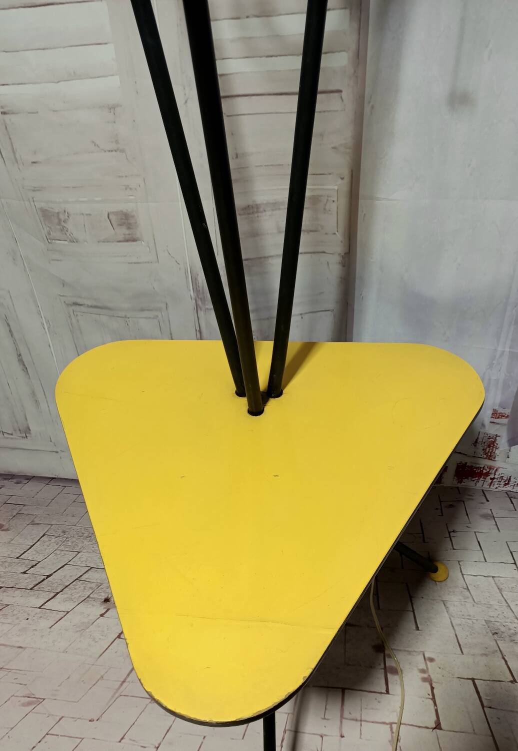 Mid-century tripod floor lamp with 3 lights and a yellow shelf.