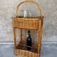 Vintage wicker bottle rack