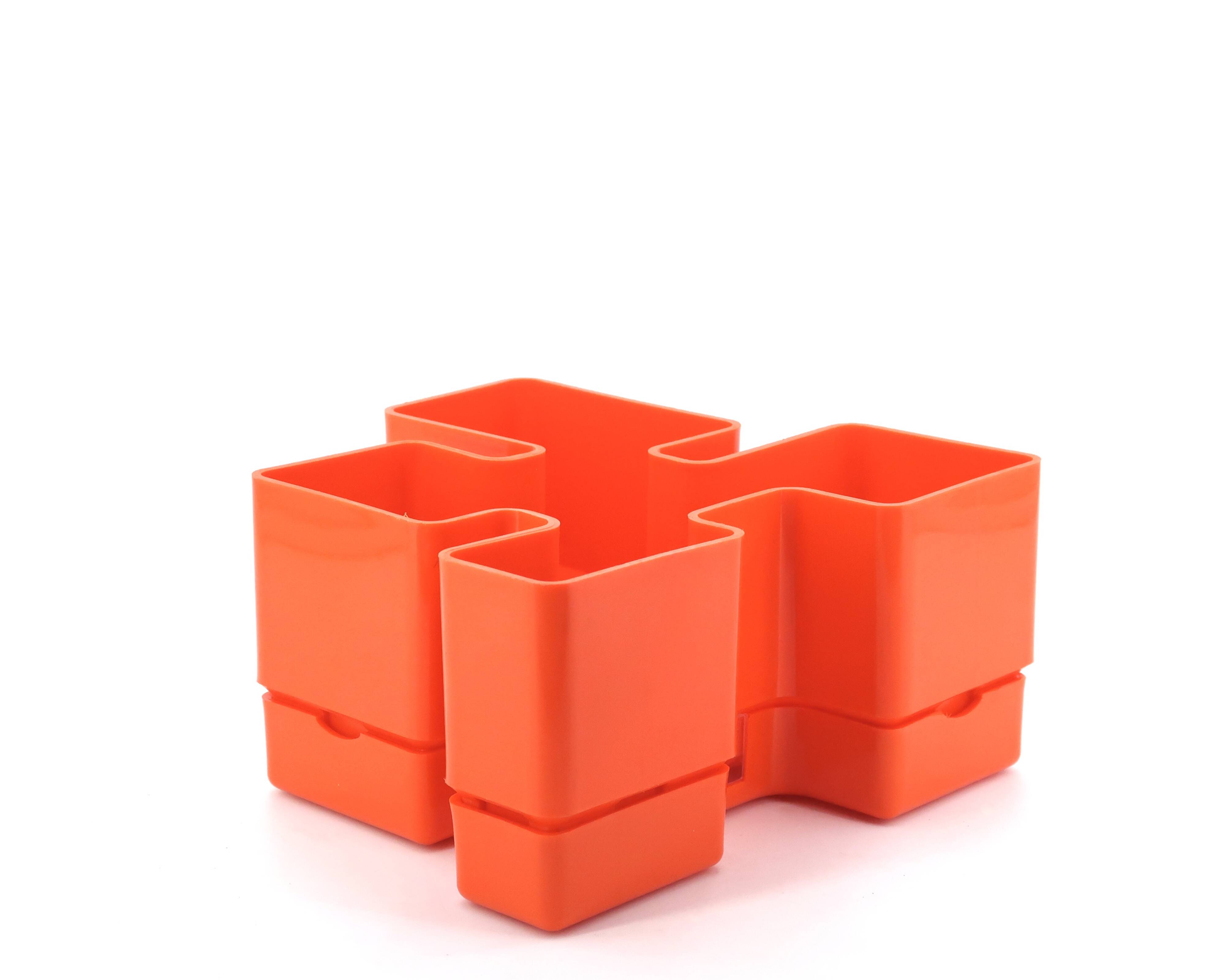 Vastill orange plastic planter by Michael McCann