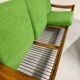 Living room sofa and Scandinavian design armchairs from the 1960s in green boucle.