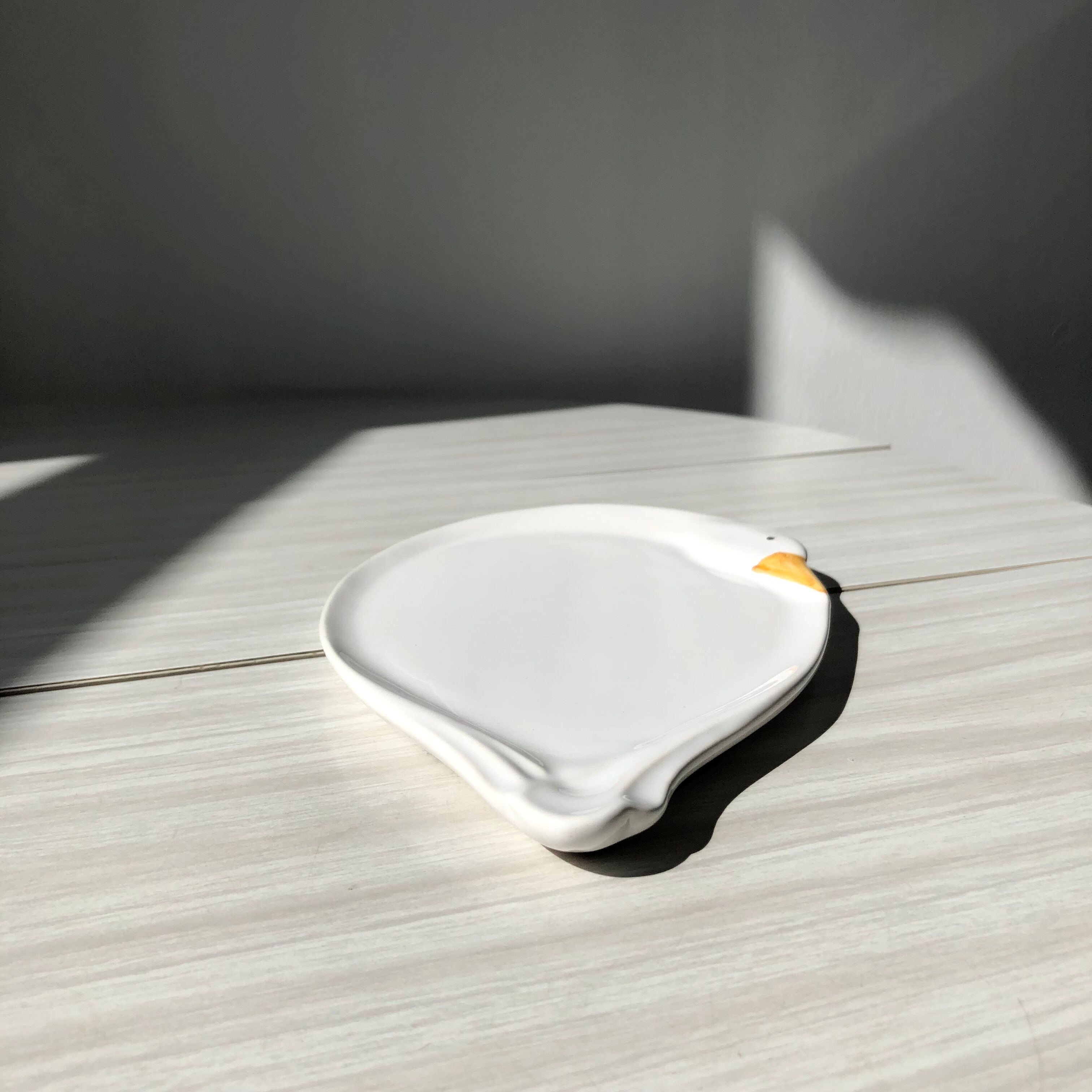 Elegant serving dish in vintage white goose ceramic. Signed DH