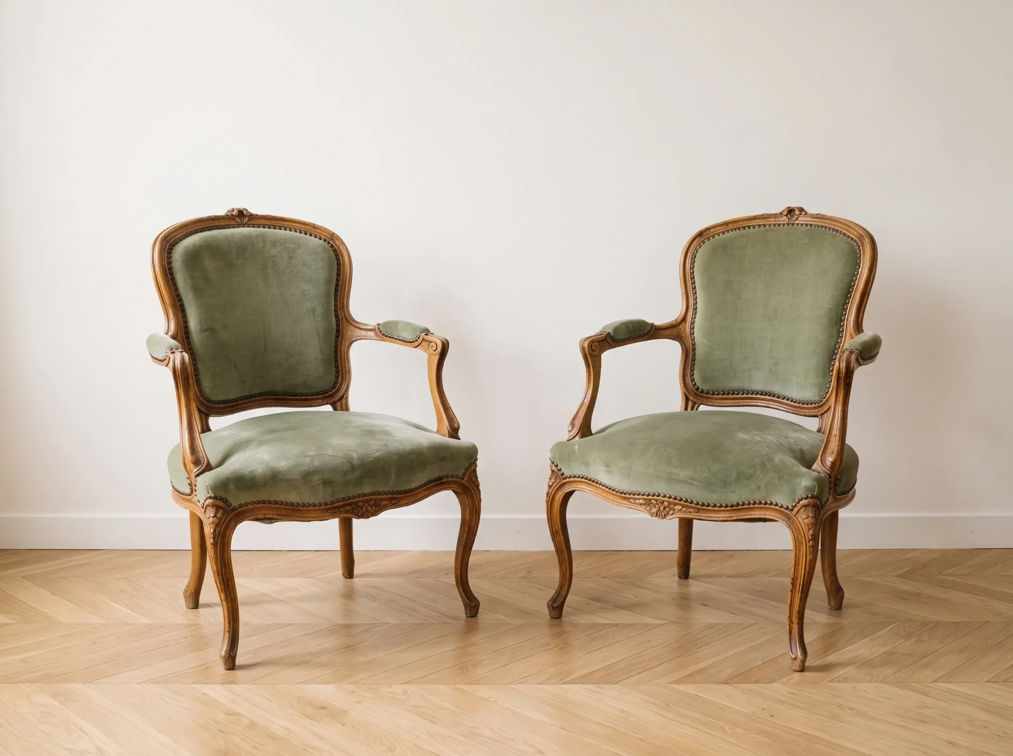 Pair of cabriolet armchairs in Louis XV style in green velvet.