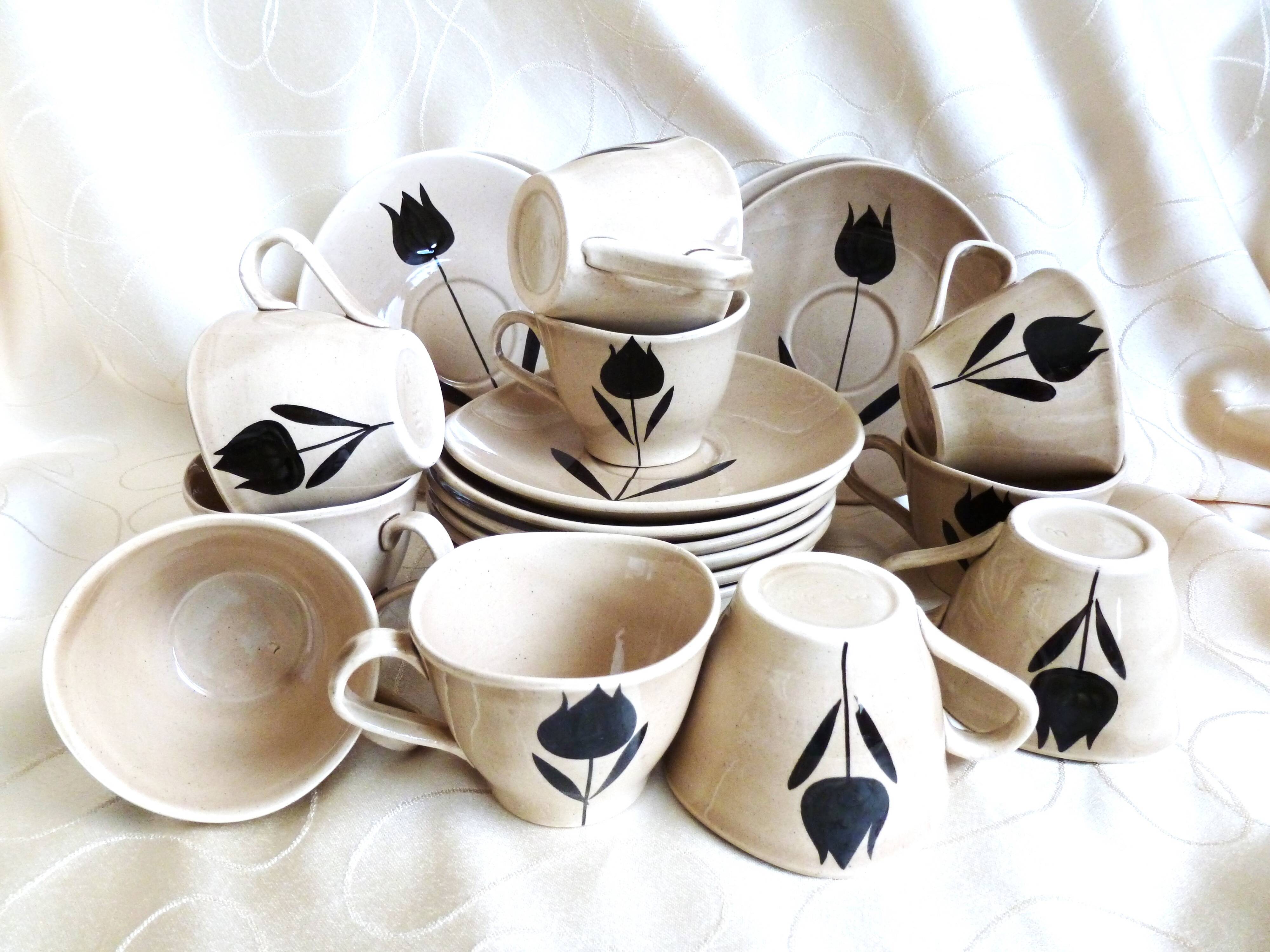 Vintage 23-piece Niderviller coffee set with hand-painted black tulip decor.