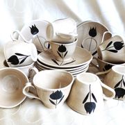 Vintage 23-piece Niderviller coffee set with hand-painted black tulip decor.
