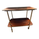 Elegant vintage serving trolley on wheels, two wooden shelves.