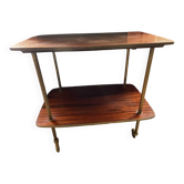 Elegant vintage serving trolley on wheels, two wooden shelves.