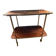 Elegant vintage serving trolley on wheels, two wooden shelves.