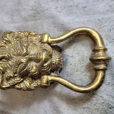 Gilded bronze door knocker in the shape of a lion's head