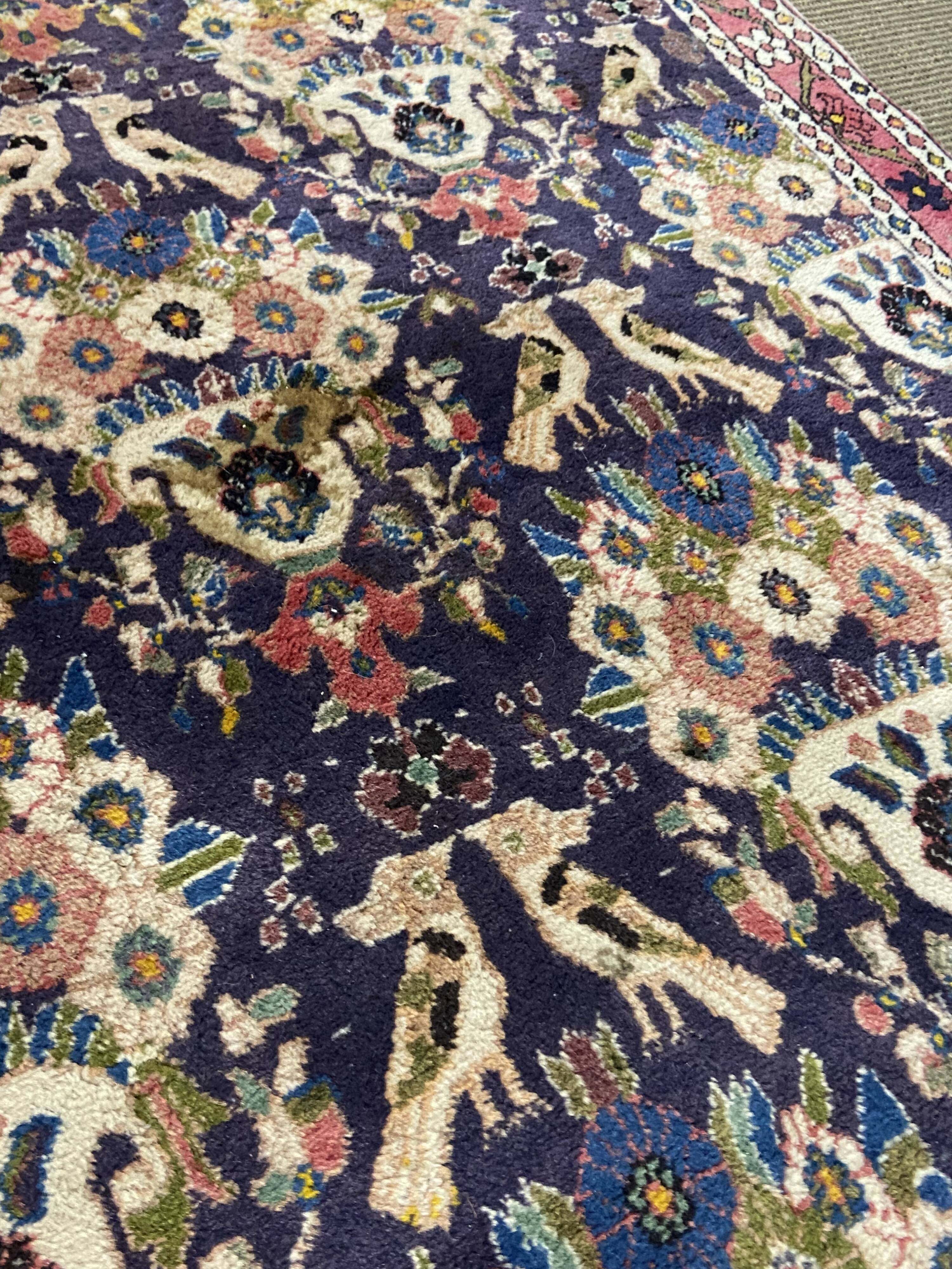 Antique Oriental rug from a nomadic tribe, 1950-1980, birds on a purple background