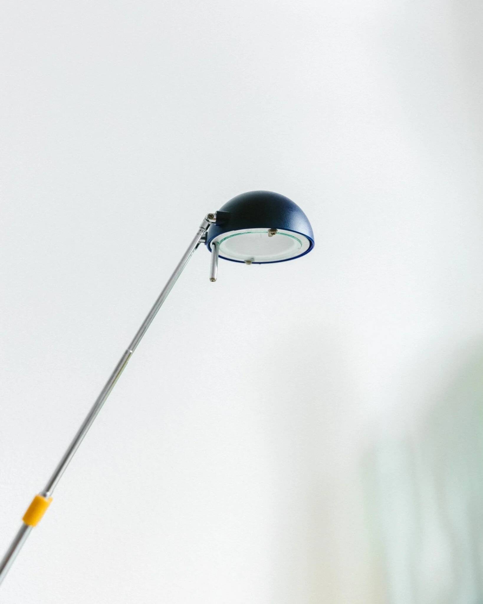 Blue-painted metal shade, chrome articulated arm desk lamp in Memphis-style 80s Pop Art with red base and yellow accents