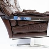 Two seater sofa upholstered with patinated brown leather and frame in metal, designed by Arne Norell