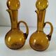 Duo of blown glass carafes – Biot signed – Bubbled amber glass
