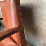 Brown leather effect Skaï bridge armchair