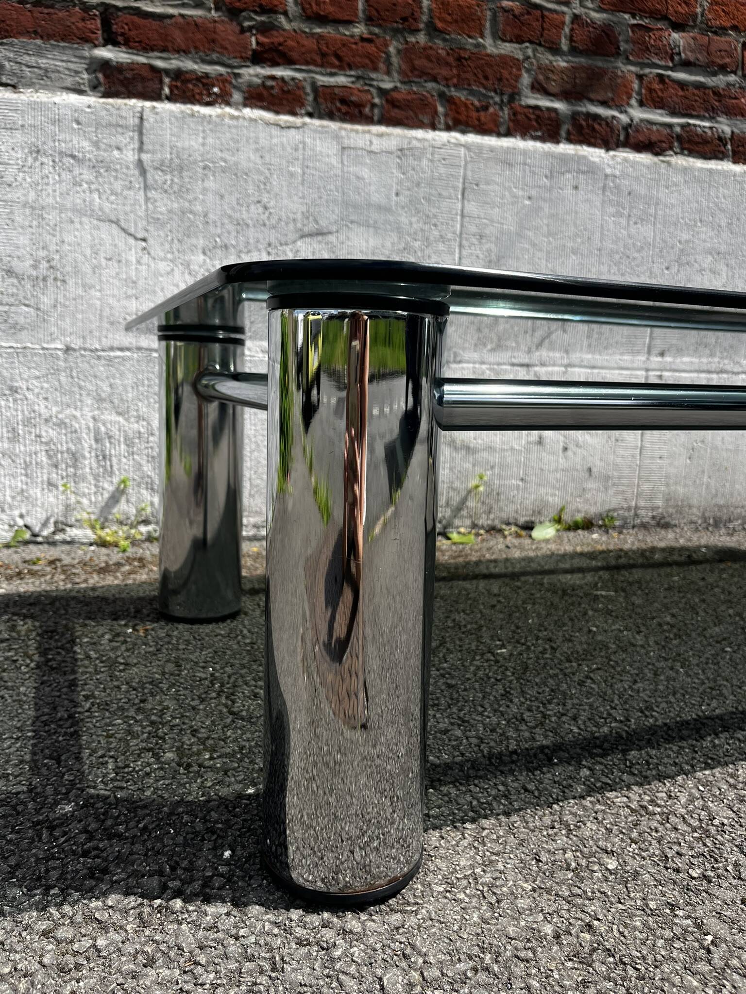 Vintage coffee table with smoked glass and chrome.
