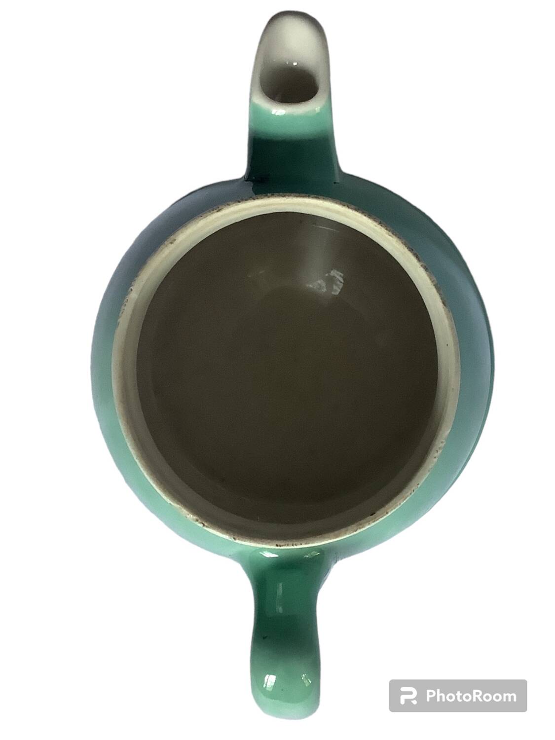 Old green ceramic teapot