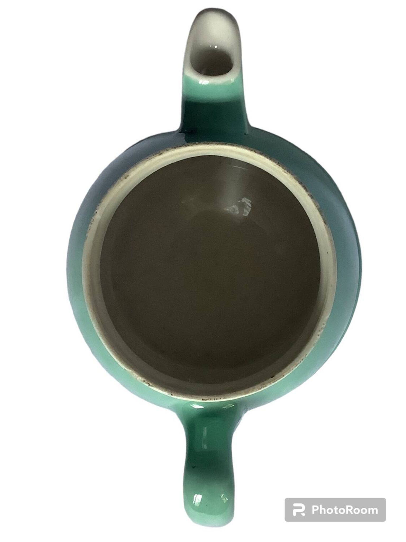 Old green ceramic teapot