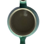 Old green ceramic teapot