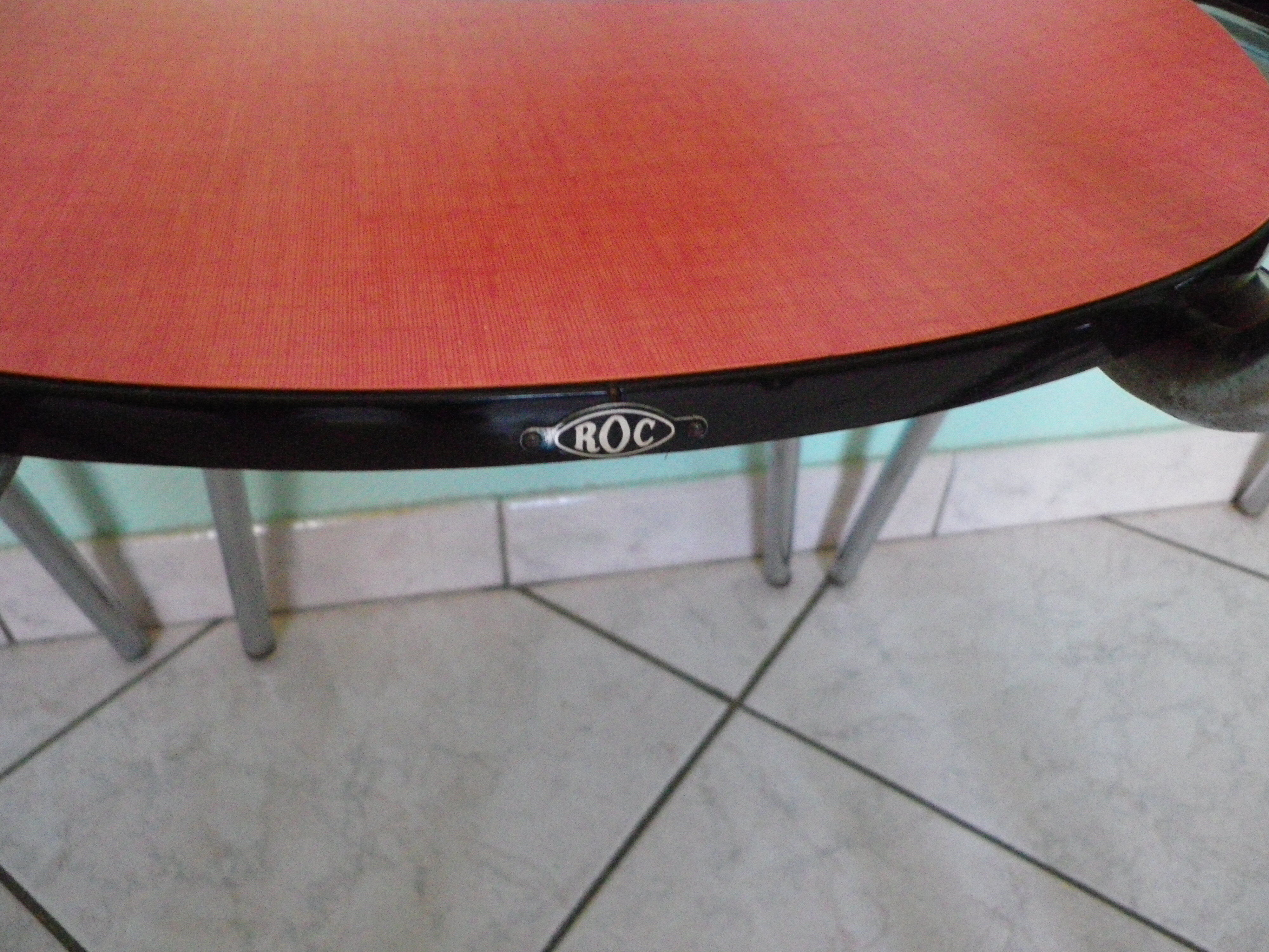 Table in red formica, 4 roc chairs, 2 extension cords, 2 drawers 60