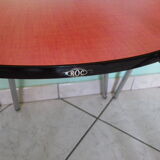 Table in red formica, 4 roc chairs, 2 extension cords, 2 drawers 60