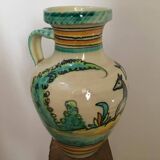 Ceramic pitcher signed Del Mazo representing doe and deer in the vegetation