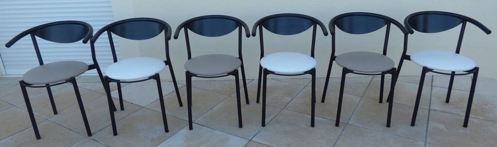 6 gondola-style chairs with a sturdy metal frame and faux leather.