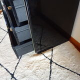 Lacquered black chest of drawers, golden brass