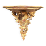 Golden console in rococo style