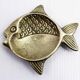 Vintage fish-shaped brass pocket emptier