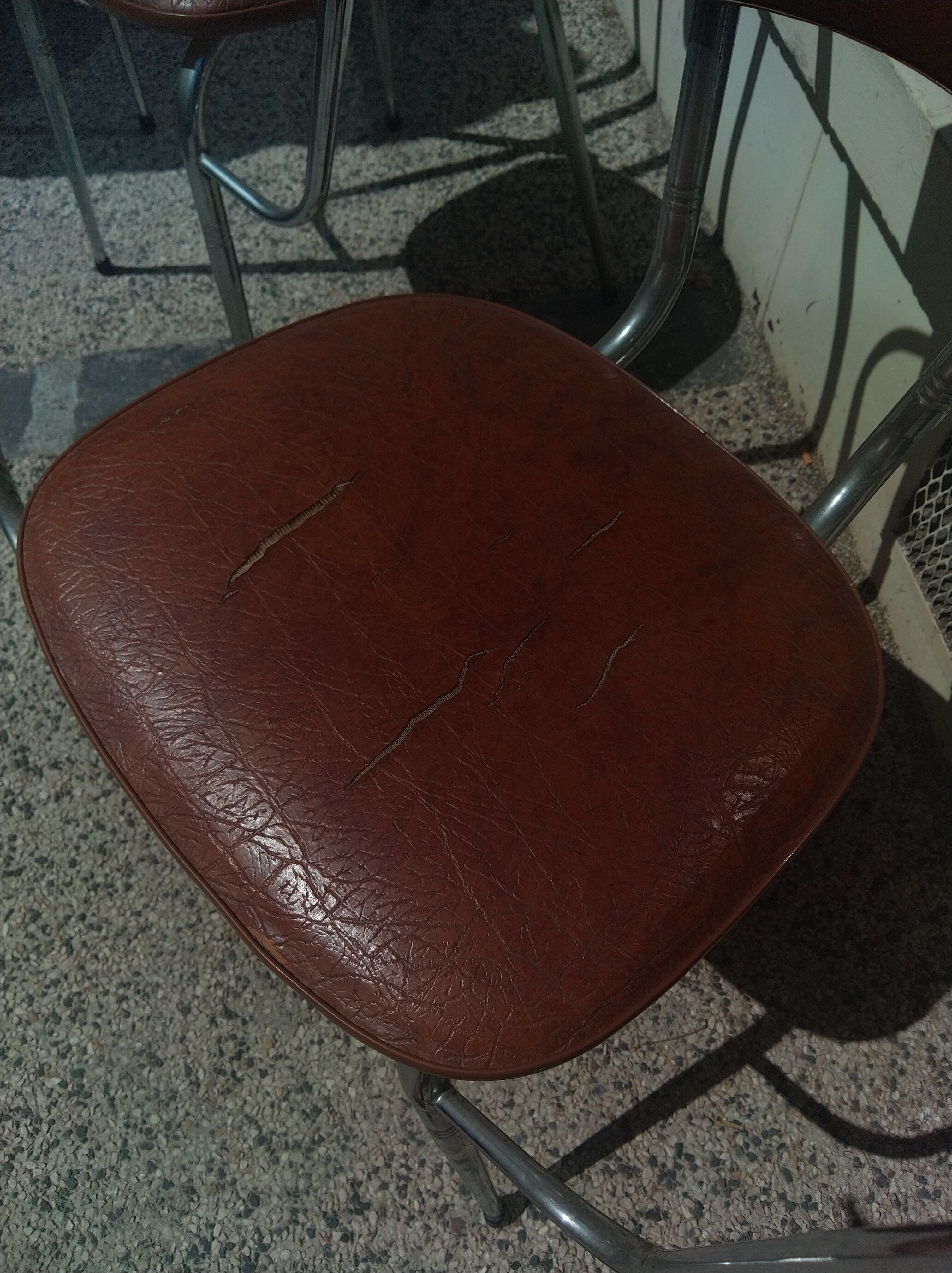 Set of 4 armchairs in chromed metal and brown imitation leather, circa 1960