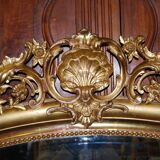 Miroir doré à fronton coquille de style Louis XV fin XIXème