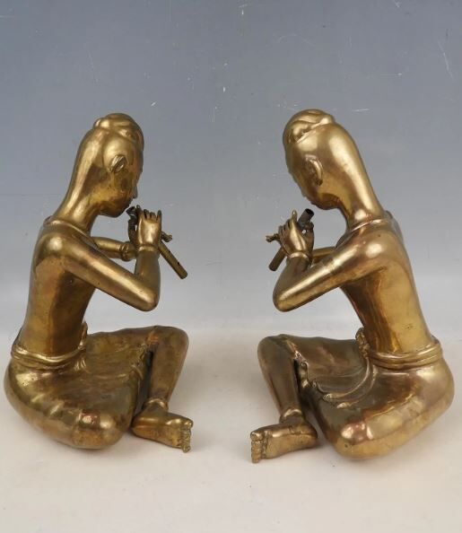 Pair of bookends in brass, flute players