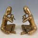 Pair of bookends in brass, flute players