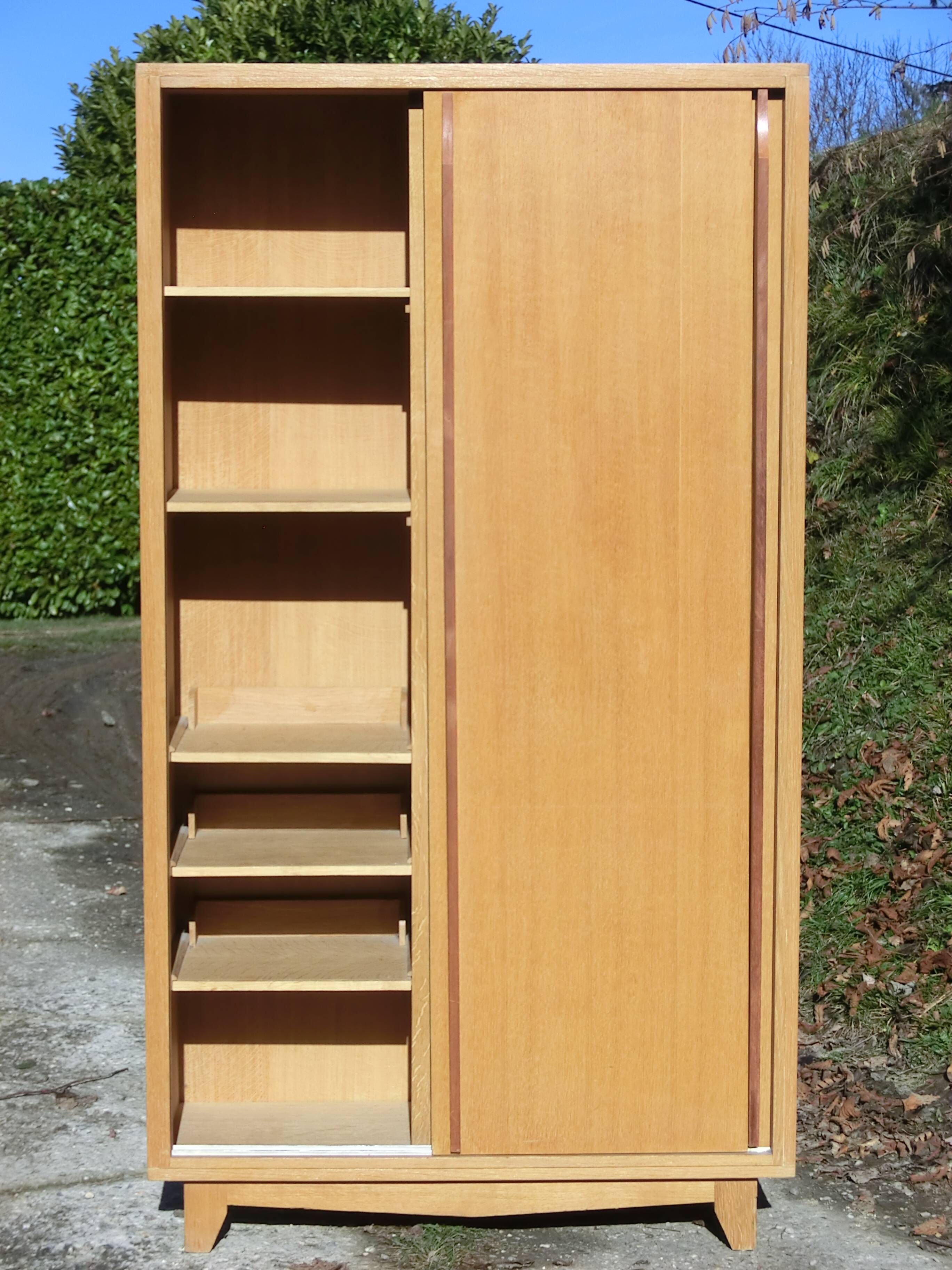 Small Scandinavian wardrobe with sliding doors - 1 side for hanging clothes.