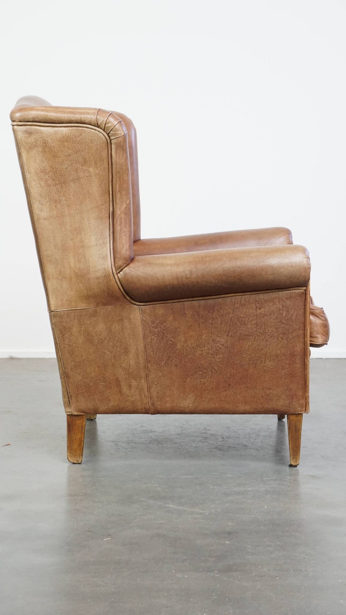 Cowhide Leather Wingback Chair in Light Cognac Color