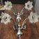 Pair of wall sconces with 2 light arms