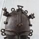 African bronze mask on pedestal, from Ivory Coast, dating