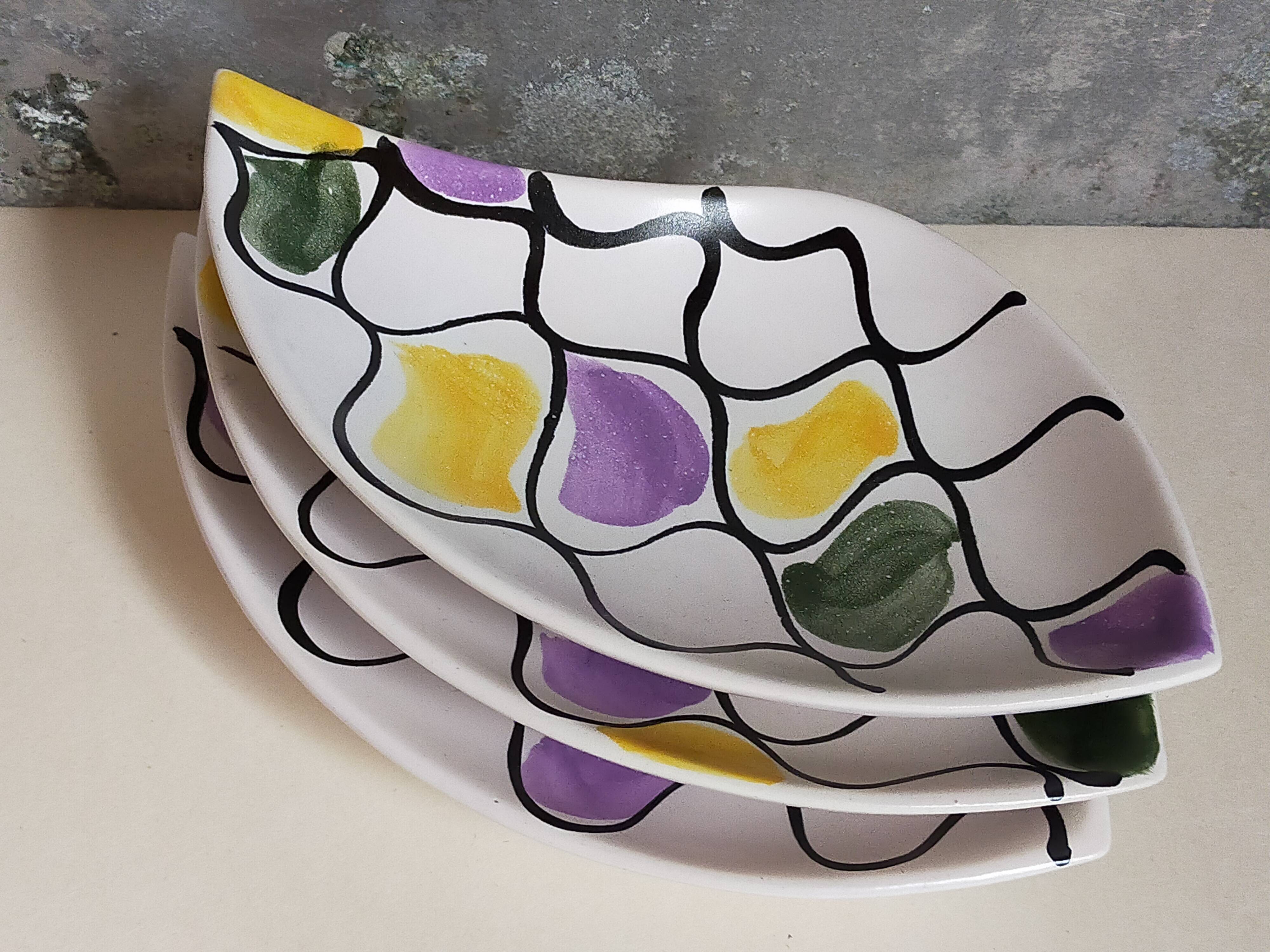 Three vintage free-form ceramic ravine dishes from the 1950s