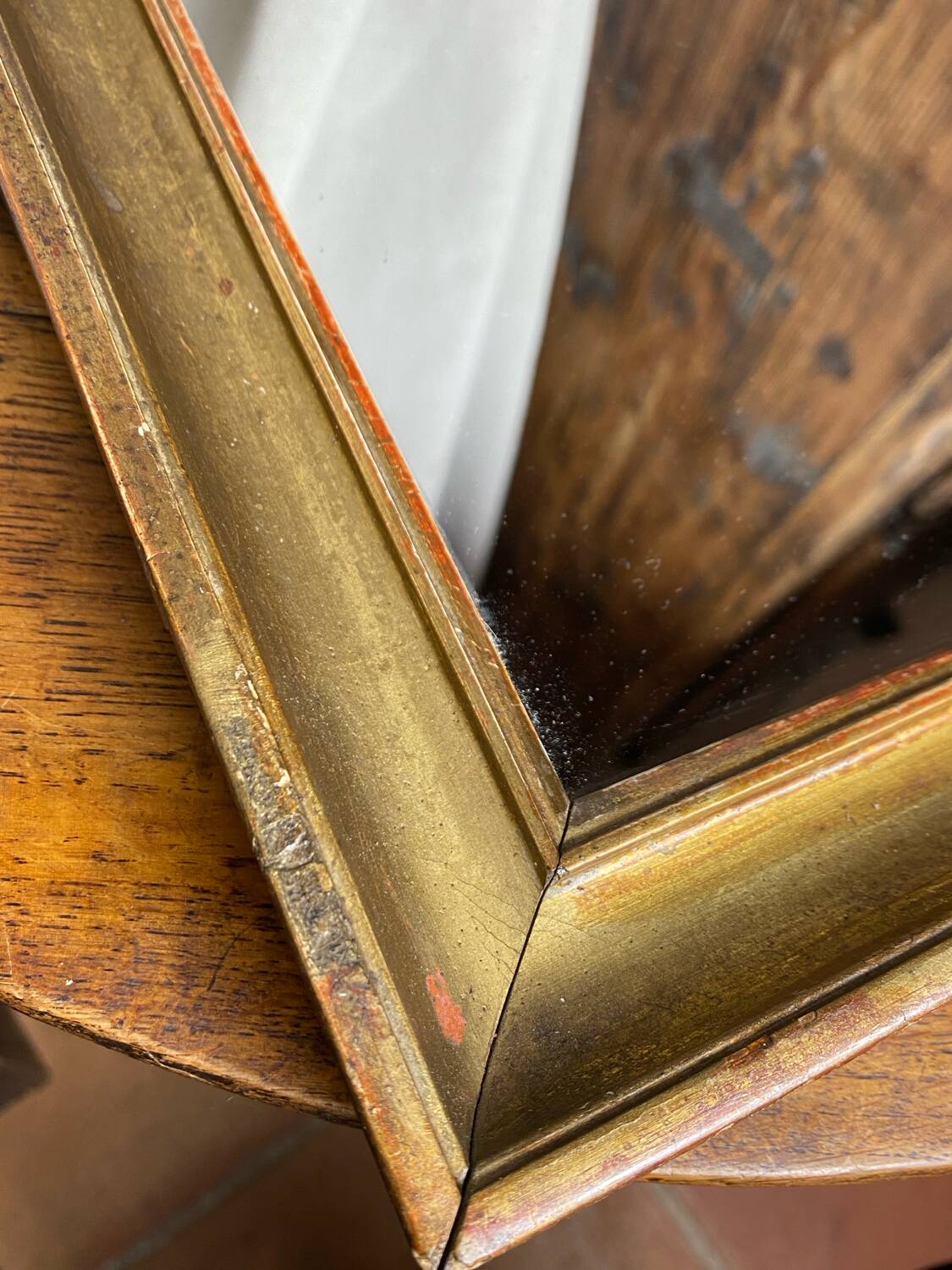 Antique mirror in gilded wood