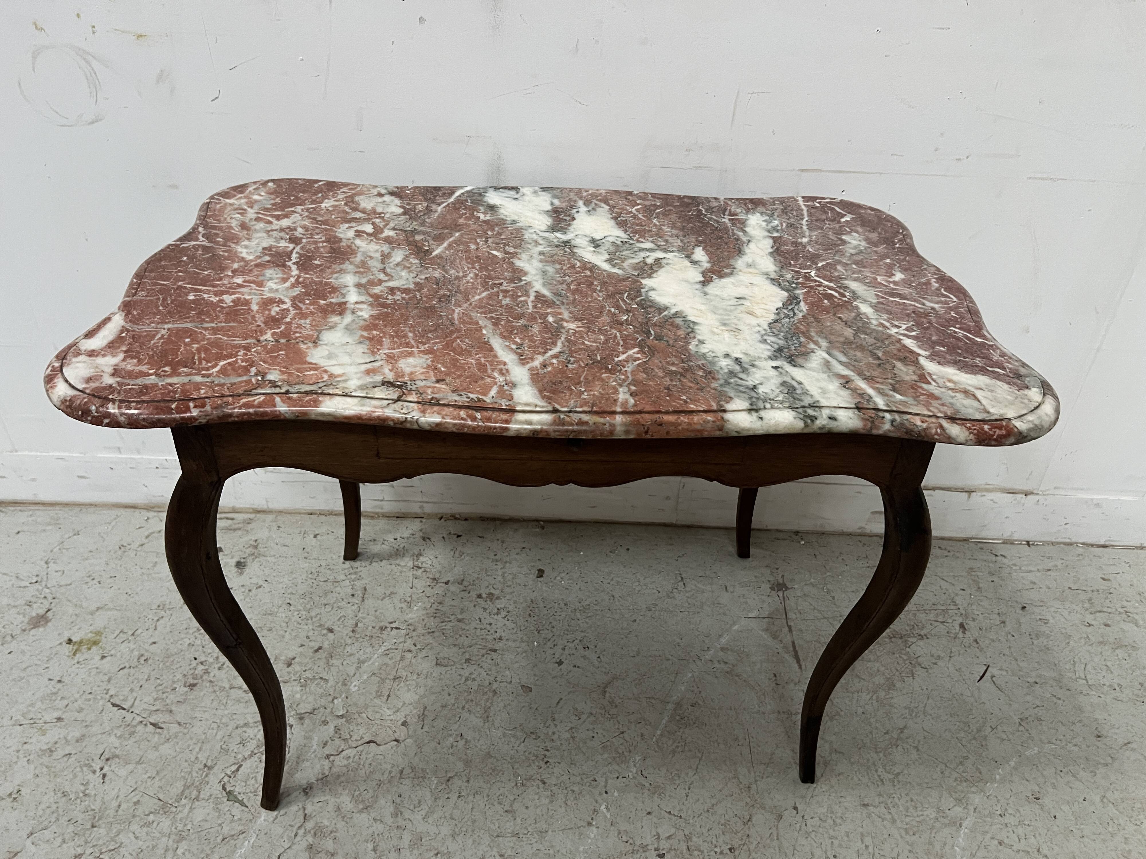 Louis XV mid-table in oak and marble, 18th century.