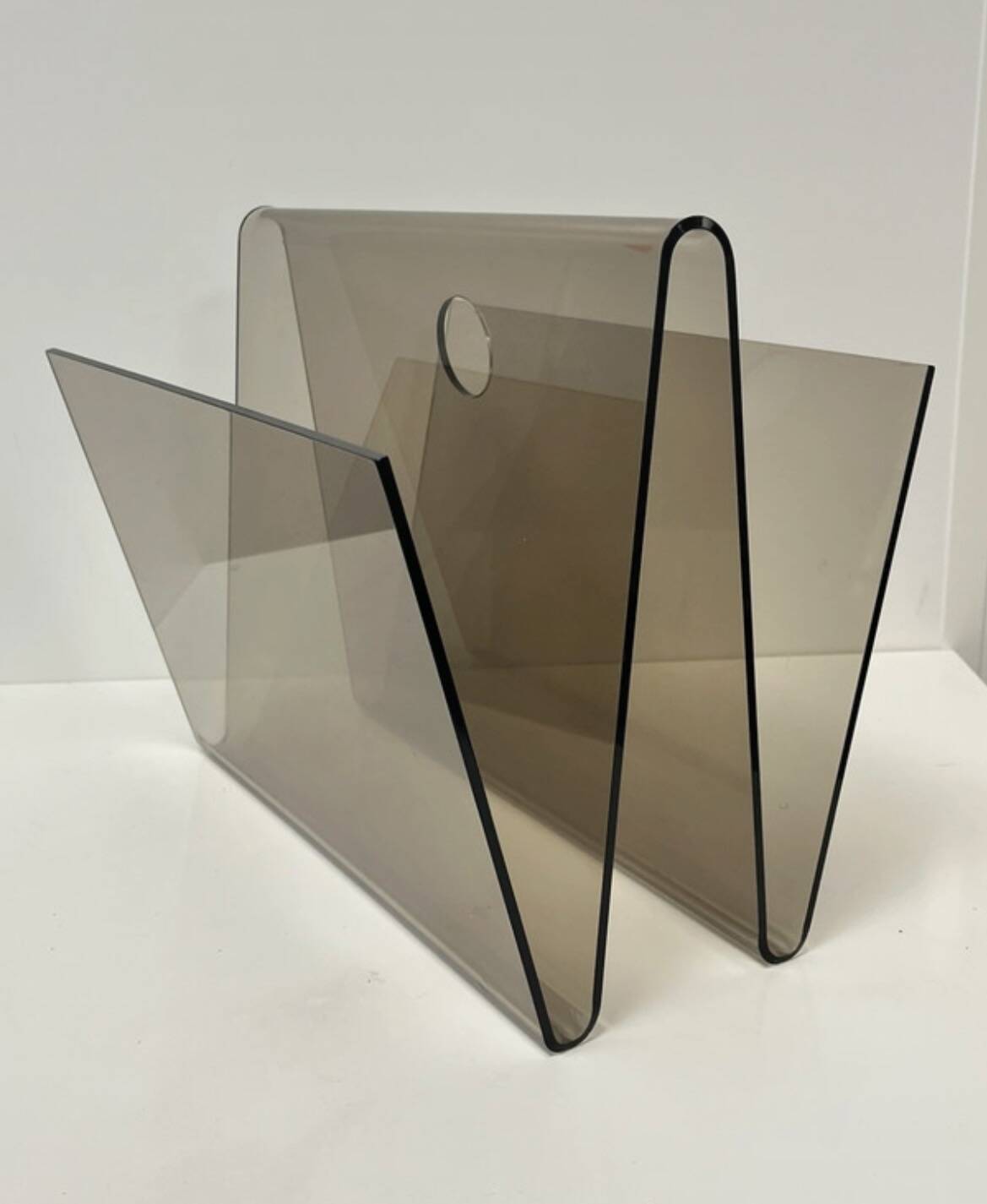 Smoked plexiglass magazine rack in the style of Michel Dumas, France, 1970s.