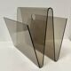 Smoked plexiglass magazine rack in the style of Michel Dumas, France, 1970s.