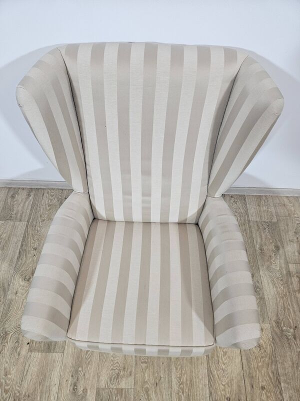 Fauteuil à oreilles avec repose-pieds, années 1960.