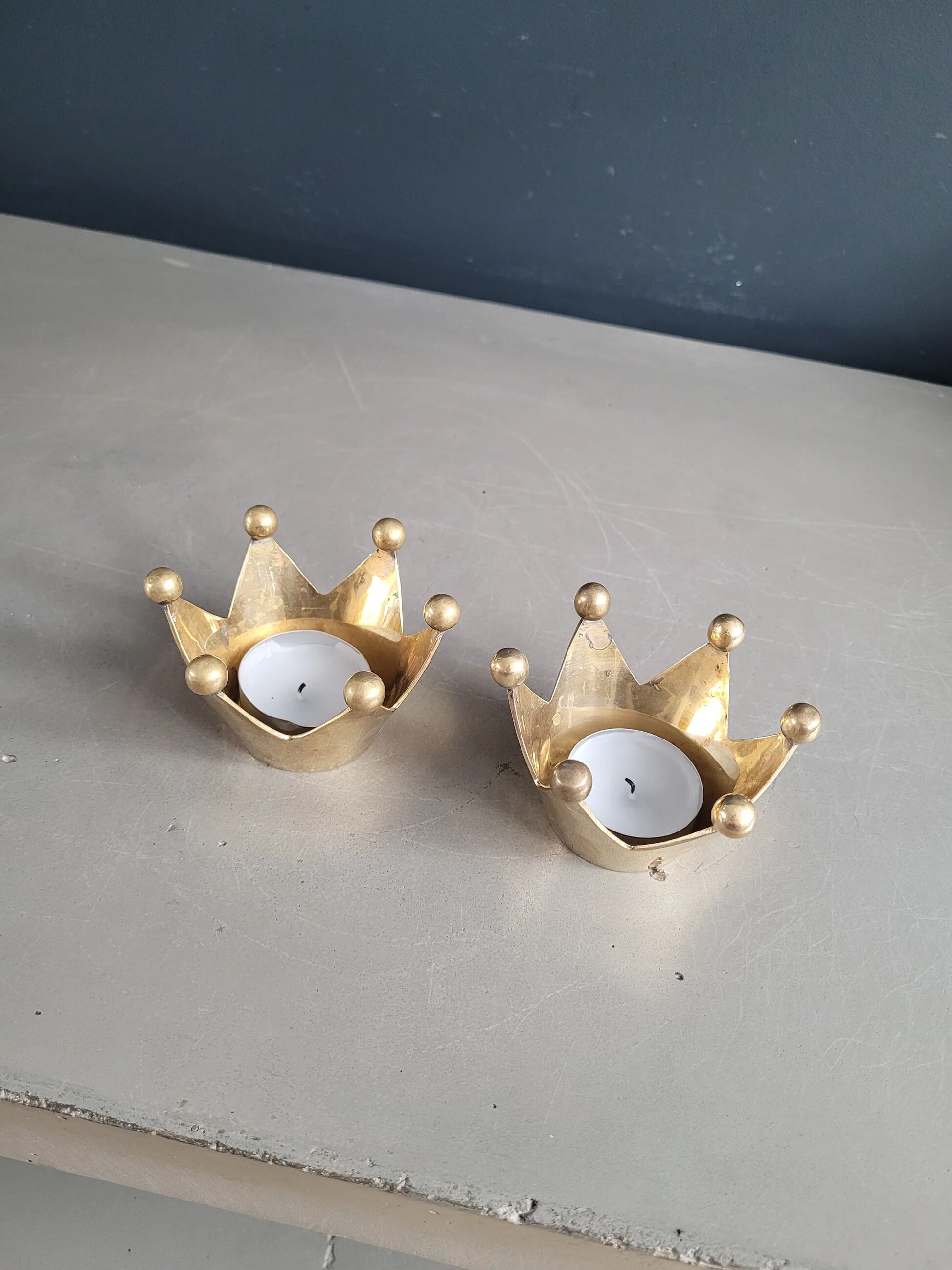 Pair of crown candle holders in brass