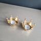 Pair of crown candle holders in brass