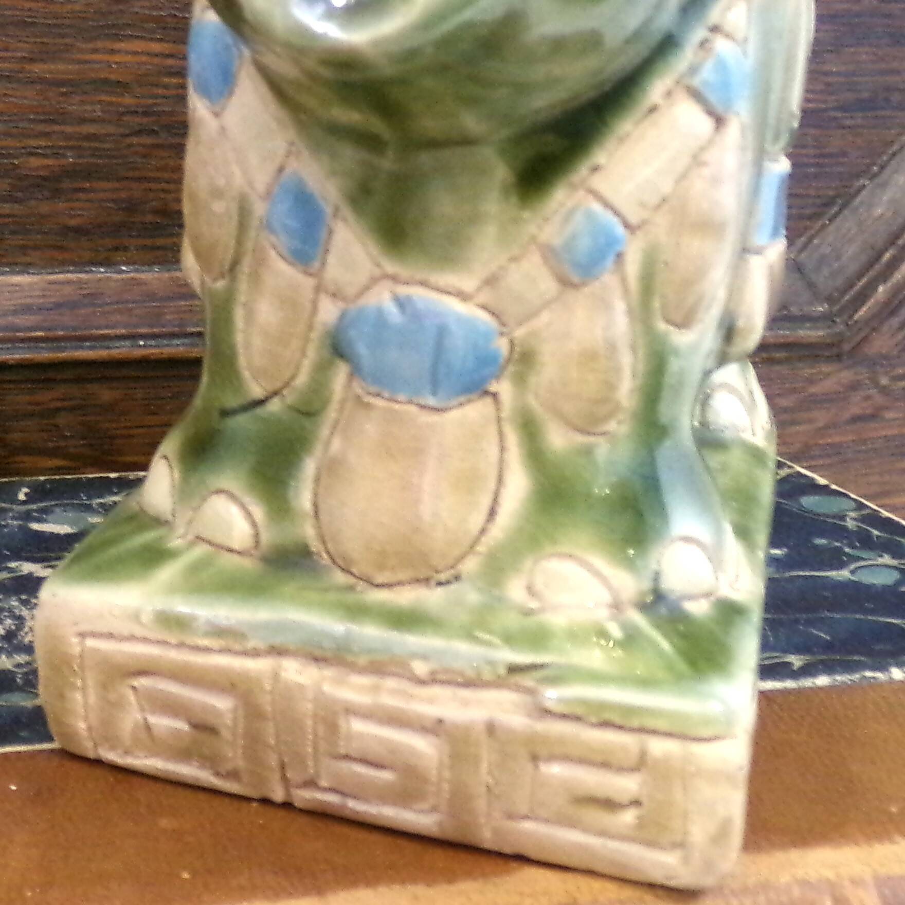 Small green ceramic elephant vase