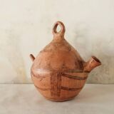 Antique oriental clay pitcher.