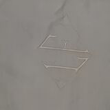 Wire tablecloth with large central monogram