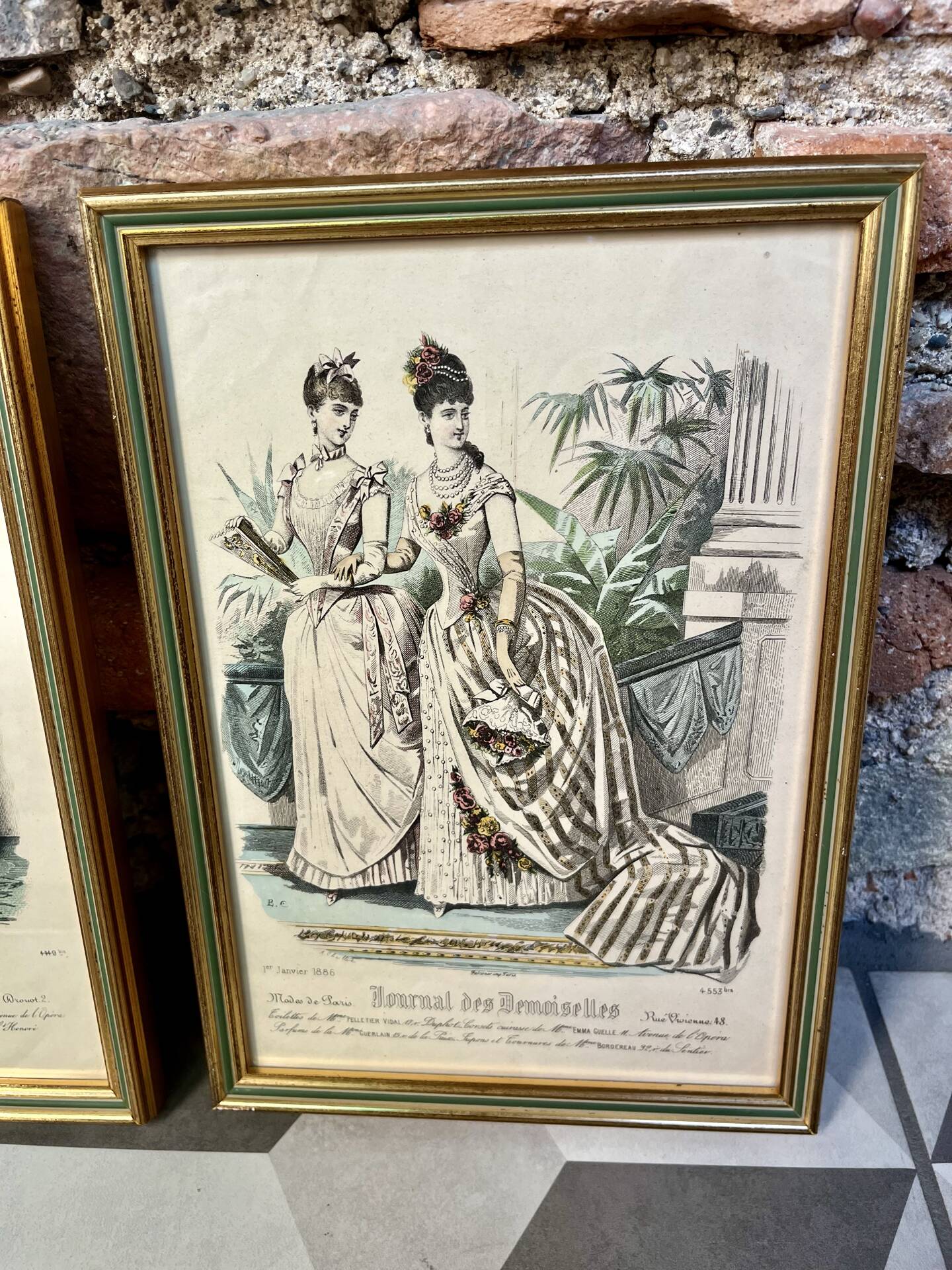 Pair of framed fashion engravings from the 19th century.
